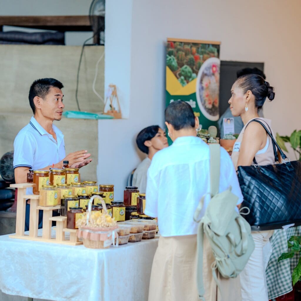 Two female dropped by Reachny Khnum's booth who also one of the Forest Ecopreneurs's venture during the closing