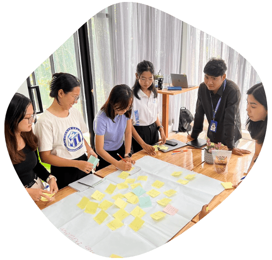 Group of youth stay in a round circle brainstorming the research about climate policies