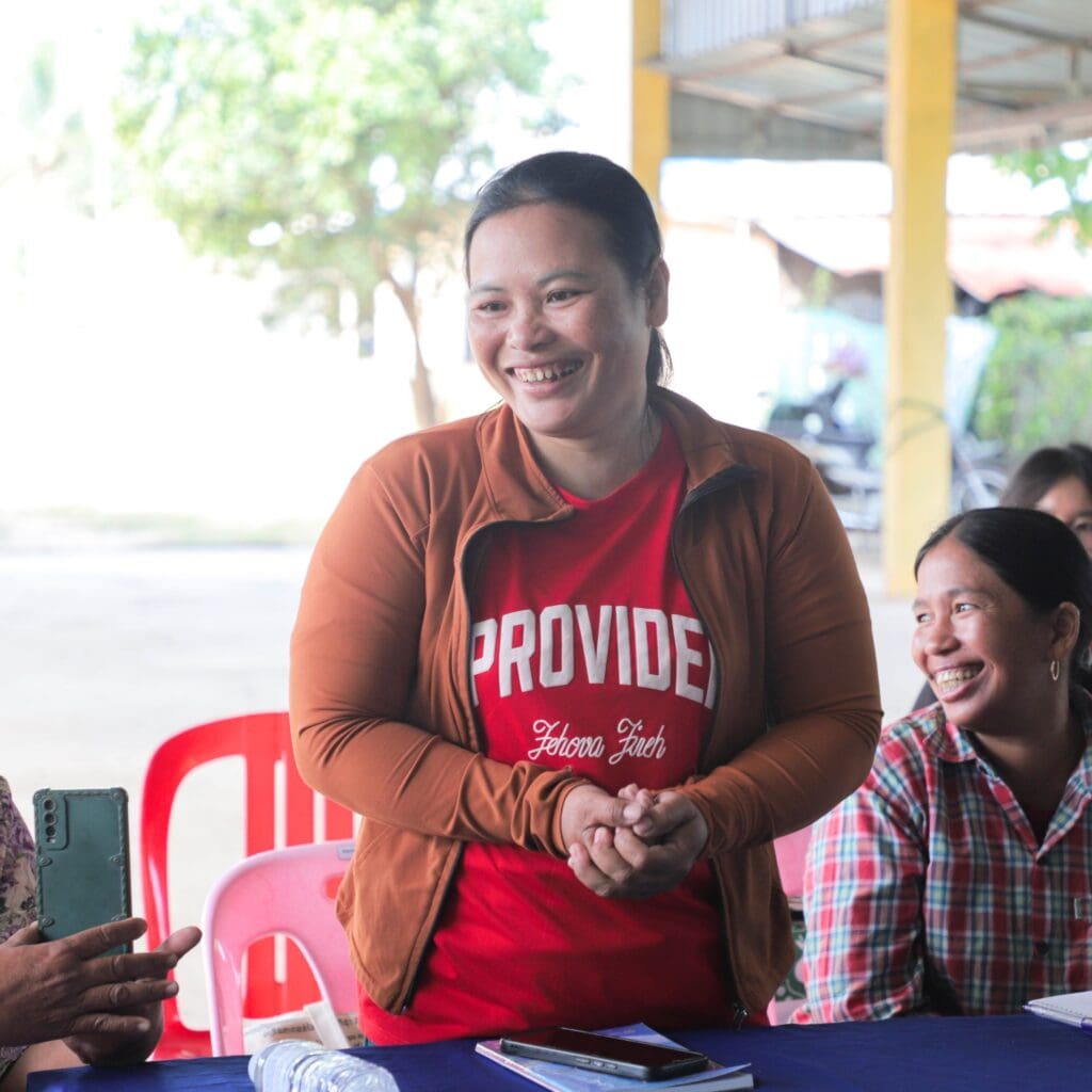 A member of Moan Srie Phum Toul Prasat Agricultural Cooperative, Chunny, smiley while giving self introduction to other AC during KAF Incubation 2 field visit