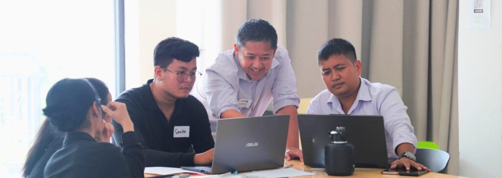A Expert Mentor, attentively guide participants of DGIx Accelerator during the Sprint Series